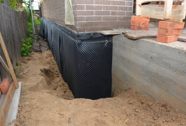 Happy homeowners after waterproofing job in Bismarck